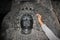 Sculpture with micro carved hallow skull at Hoysaleswara Temple