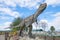 A sculpture of a predatory dinosaur - carnotaurus close up. Theme children`s park `Yurkin Park`