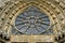 Sculpture and rose window of Cathedral Notre-Dame