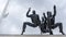 Sculpture Running with men runners monument on dramatic sky background. Running man or marathon runner.