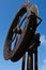 Sculpture: rusty iron ship wheel