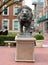 Sculpture of Scholars` Lion by Greg Wyatt stands on large granite pedestal at Columbia University in New York City