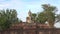 Sculpture of a seated Buddha at the ruins of a Buddhist temple, Wat Mae Chon. Sukhothai, Thailand