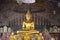 A sculpture of a seated Buddha in the temple of Wat Rakhang Khositaram Ubosot. Bangkok, Thailand