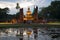 The sculpture of a seated Buddha in the twilight. Sukhothai, Thailand