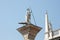 Sculpture of St. Theodore as a symbol of Venice. Sunny summer day. Venice, Italy