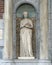 Sculpture of a woman in a Nave between two columns, beside the entrance to the Rijksmuseum, Amsterdam