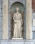 Sculpture of a woman in a Nave between two columns, beside the entrance to the Rijksmuseum, Amsterdam