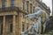 The sculpture of a writer at the base of the Franconia Fountain on Residence Square in Wurzburg, Germany