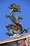 A sculptured dragon decorates the ridgepole of a buddhist temple in Saigon (Vietnam)
