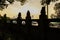 Sculptures on balustraded highway bridge in city at twilight