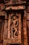 Sculptures of hindu gods on facade of 7th century temple carved walls in Pattadakal