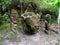 Sculptures with human and animal shapes in an ancient megalithic settlement on Lake Toba, Pulau Samosir. Indonesia