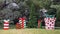 Sculptures of large Christmas gifts with bows and an undecorated Christmas tree before a mansion in Highland Park, Dallas, Texas