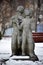 Sculptures of lovers, man and woman in winter park, Kyiv, Ukraine. Couple sculpture standing in the garden in the mood