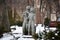 Sculptures of lovers, man and woman in winter park, Kyiv, Ukraine. Couple sculpture standing in the garden in the mood