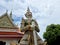 The sculptures of mythical giant demons, Sahatsadecha, guarding the eastern gate of the main chapel of Wat Arun Ratchawararam