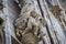 Sculptures of saints and martyrs decorating the Cathedral of Milan Duomo di Milano are shot close-up.