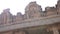 Sculptures and stone statues on the facade of an ancient Indian temple in the city of Hampi