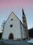 Scuol church in winter time evening