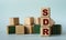 SDR - acronym on wooden cubes on a background of colored block on a light background