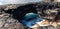 Sea Arch on Volcanic Shoreline of Keiki Beach