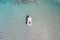 Sea background texture. Aerial drone view of inflatable boat in Elafonisi island water Greece