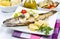 Sea bass grilled with lemon ,salad and potatoes