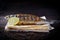 Sea bass served with lemon and sauce. Grill dishes, seafood or fish and pita for the restaurant menu. Wooden background.