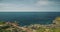 Sea bay with green cliff shore aerial view. Nature nobody landscape of Sumba Island, Indonesia