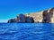 Sea bay rock view. Coast sea. Massive rocks by the sea, blue sky and sea, sea waves. Mediterranean coastline. Calm sea water.