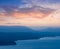 Sea bay with rocky coast silhouette at the dawn