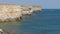 Sea bay of turquoise color near coastal cliffs