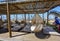 Sea beach bar umbrellas and chairs by sand in preveza, monolithi beach greece