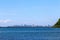 The sea beach with blue sky and cloud and mountains at Pattaya.