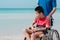 Sea beach with father,Lifestyle of disability child, Life in the education age