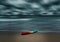 Sea and beach storm with banana boat, Motion blur