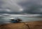 Sea and beach storm with fishing boat, Motion blur