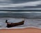 Sea and beach storm with fishing boat, Motion blur