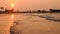 Sea beach water wave and dramatic nature sunset over boat unfocused tourist are around there