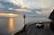 Sea beautiful sunset winding road white car horizon clouds travel vacation background