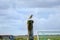 Sea bird seitting on a wooden column