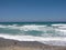 Sea Blue sea waves on the beach. Sandy beach. Sea water. Sea shells. Summer background.