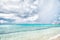 Sea with boats and port in grand turk, turks and caicos islands. Seascape with turquoise water on cloudy sky. Summer vacation on t