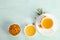 Sea buckthorn in porcelain bowl, honey and cup of tea