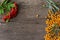 Sea buckthorn and Rowan berries on a wooden background. Autumn