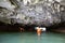 Sea cave and kayakers
