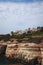 Sea Caves, Rocky Coast with a city above