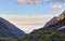 Sea of clouds below mountains