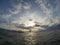 Sea and cloudy sunset fish eye photo. Tropical sunset on sea. Tropic island seashore with sun and cloud.